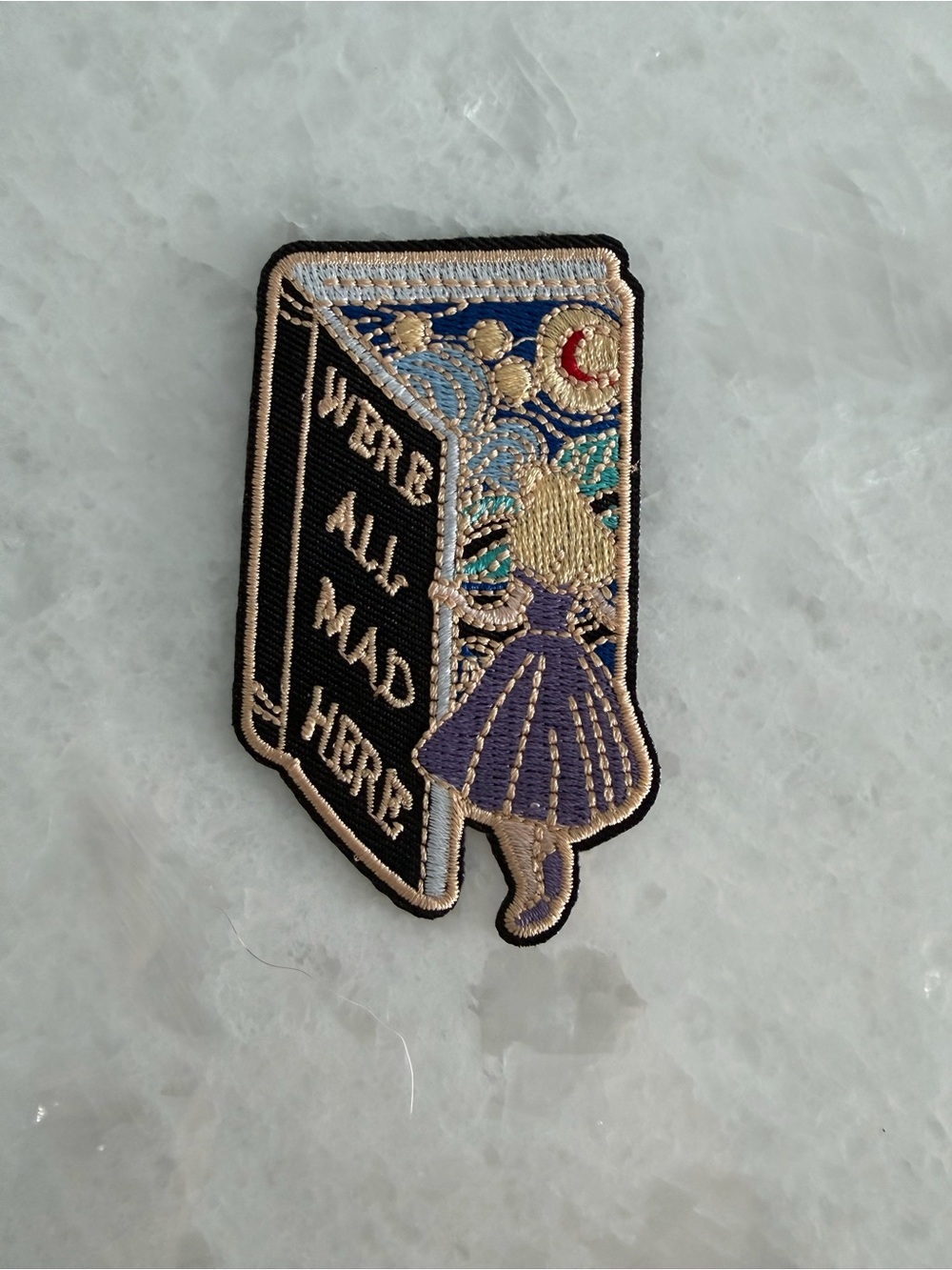 Embroidered Alice 'We're All Mad Here' Book Patch – Purple, Black, Gold